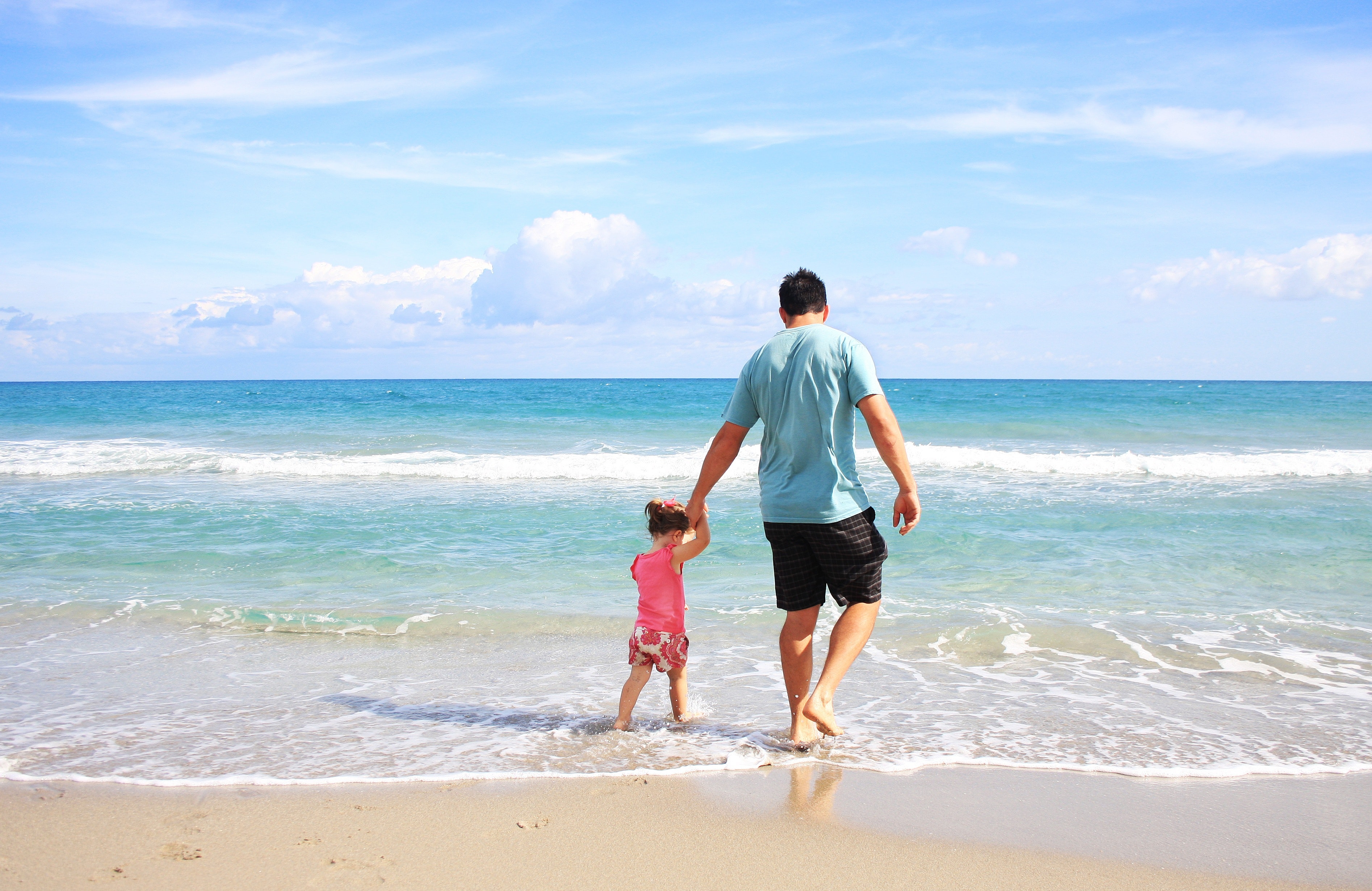 Dad and daughter on the beach